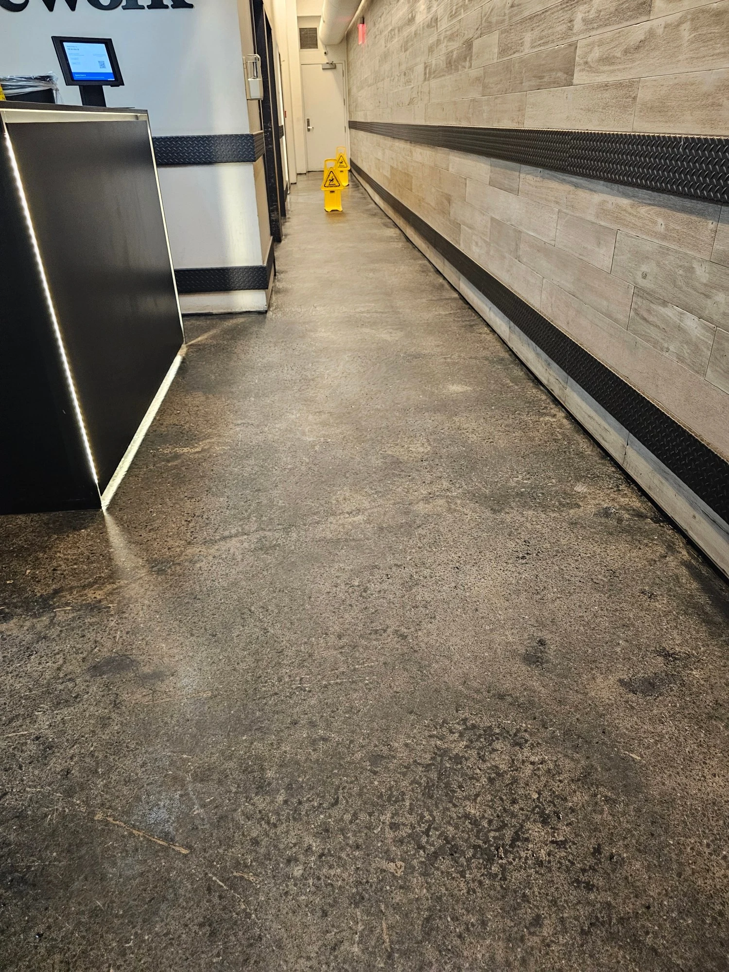 Commercial corridor floor before maintenance